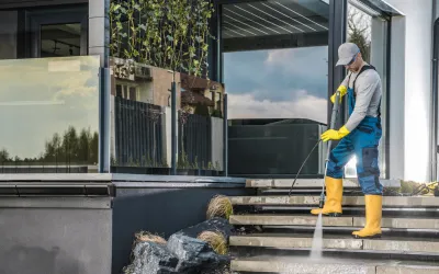 Professional pressure washing a commercial building exterior in Cairns