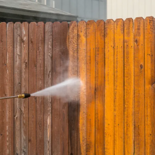 Professional fence cleaning by our worker in Bentley Park