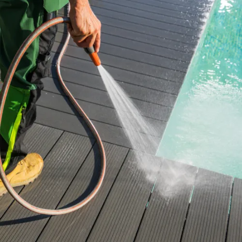 Pool area being cleaned by worker